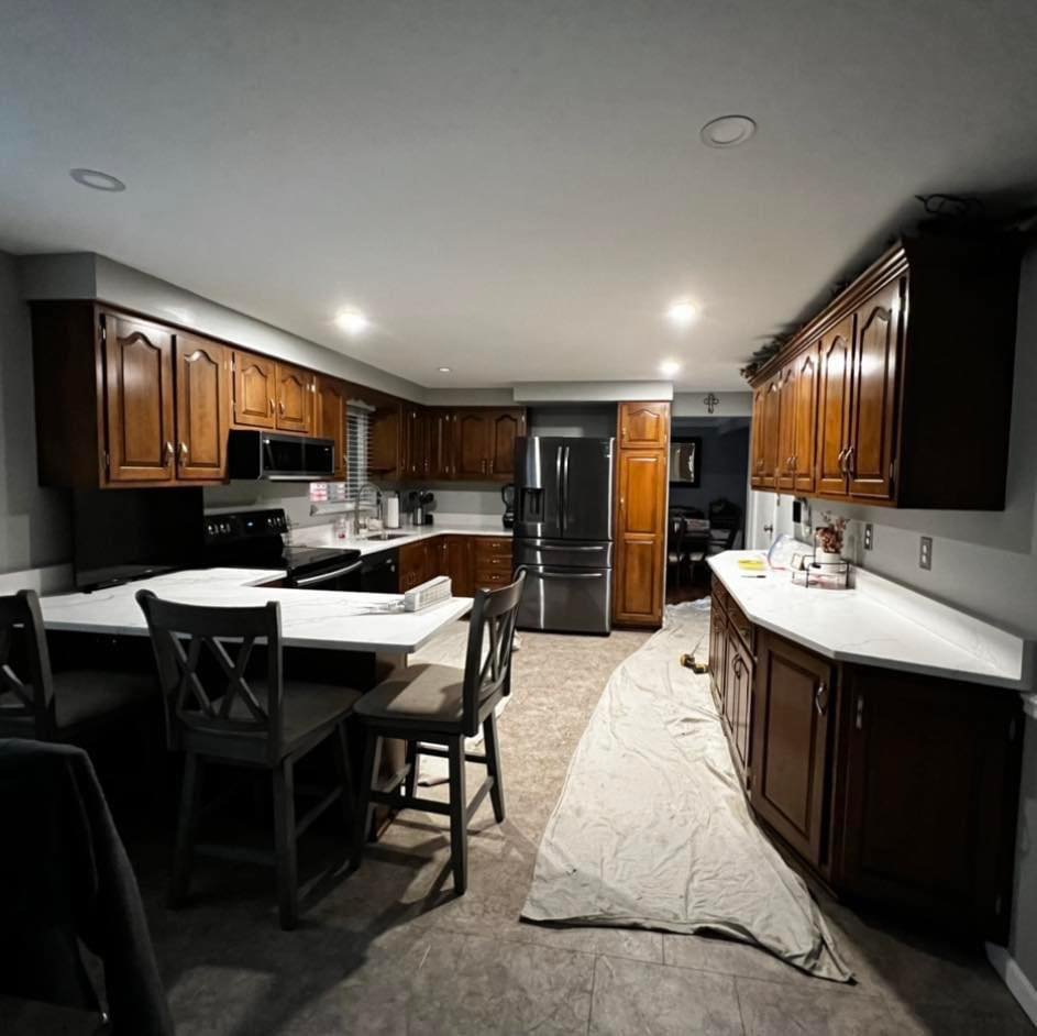 Dark wood kitchen cabinets before refinishing